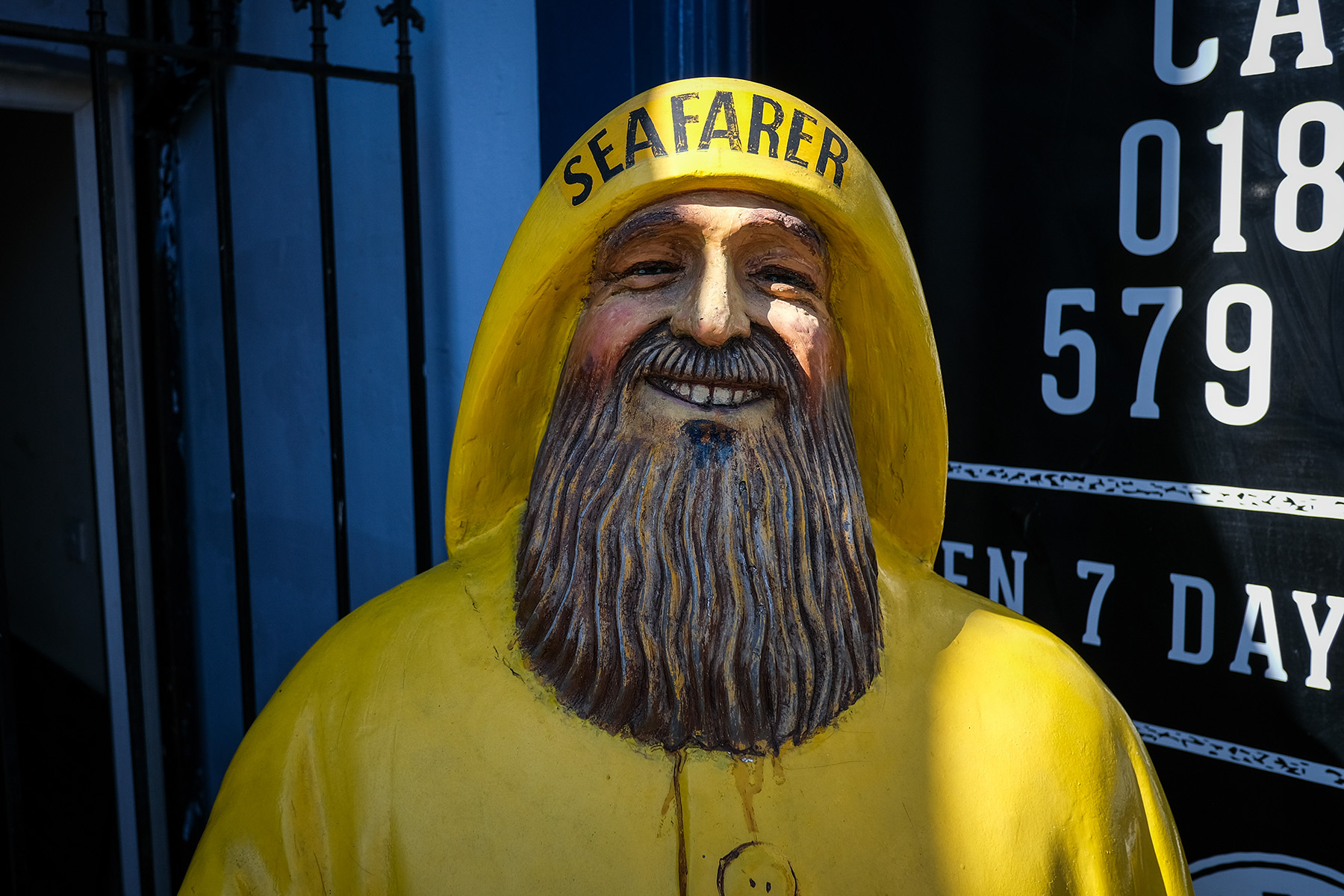 smiling sea farer statue